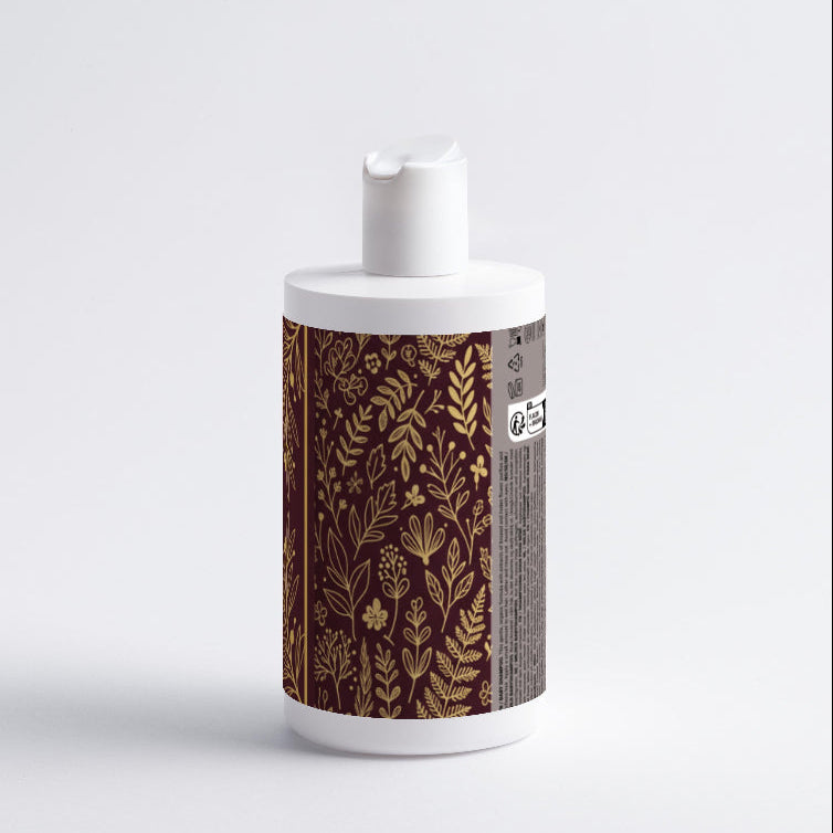 Decorative bottle with gold leaf pattern on a white background