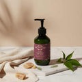 AUREQ 5% Urea Panthenol Body Cream pump bottle on marble tray with leaves and towel, intensive hydrating urea body cream