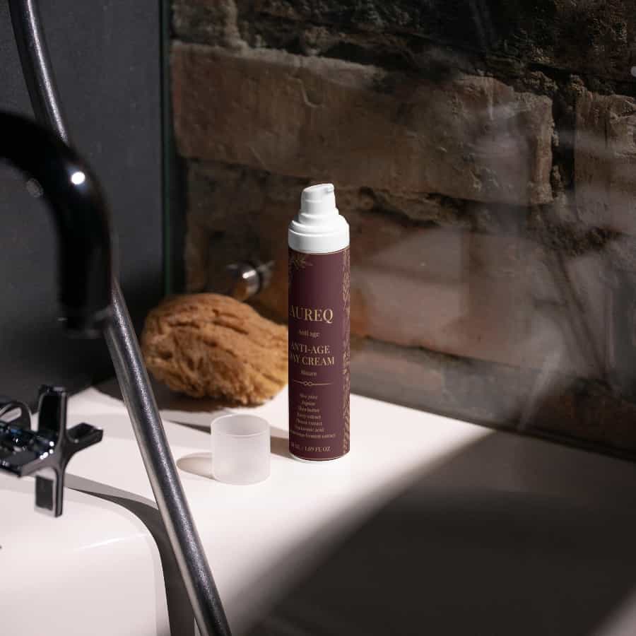Alt Tag: hyaluronic acid cream AUREQ Anti-Age Day Moisturizer 50ml bottle on bathroom sink counter