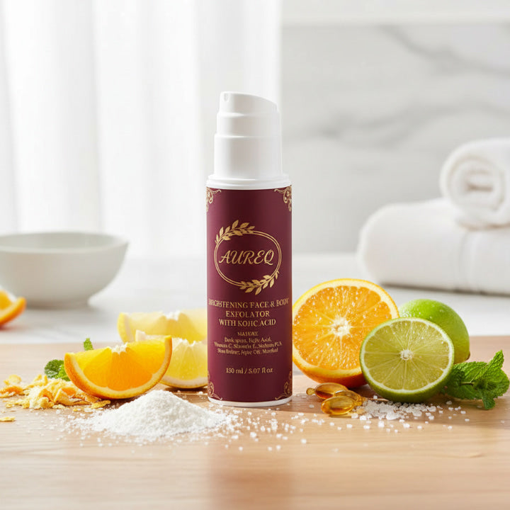 Aureo exfoliant bottle with citrus fruits on a wooden surface