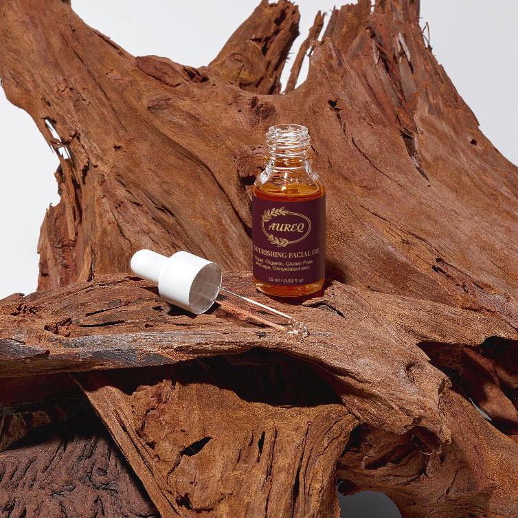 Facial oil bottle with dropper on a wooden surface